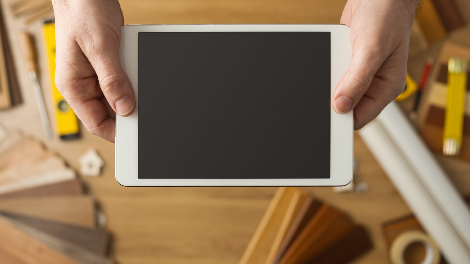 Craftsman holding a digital tablet